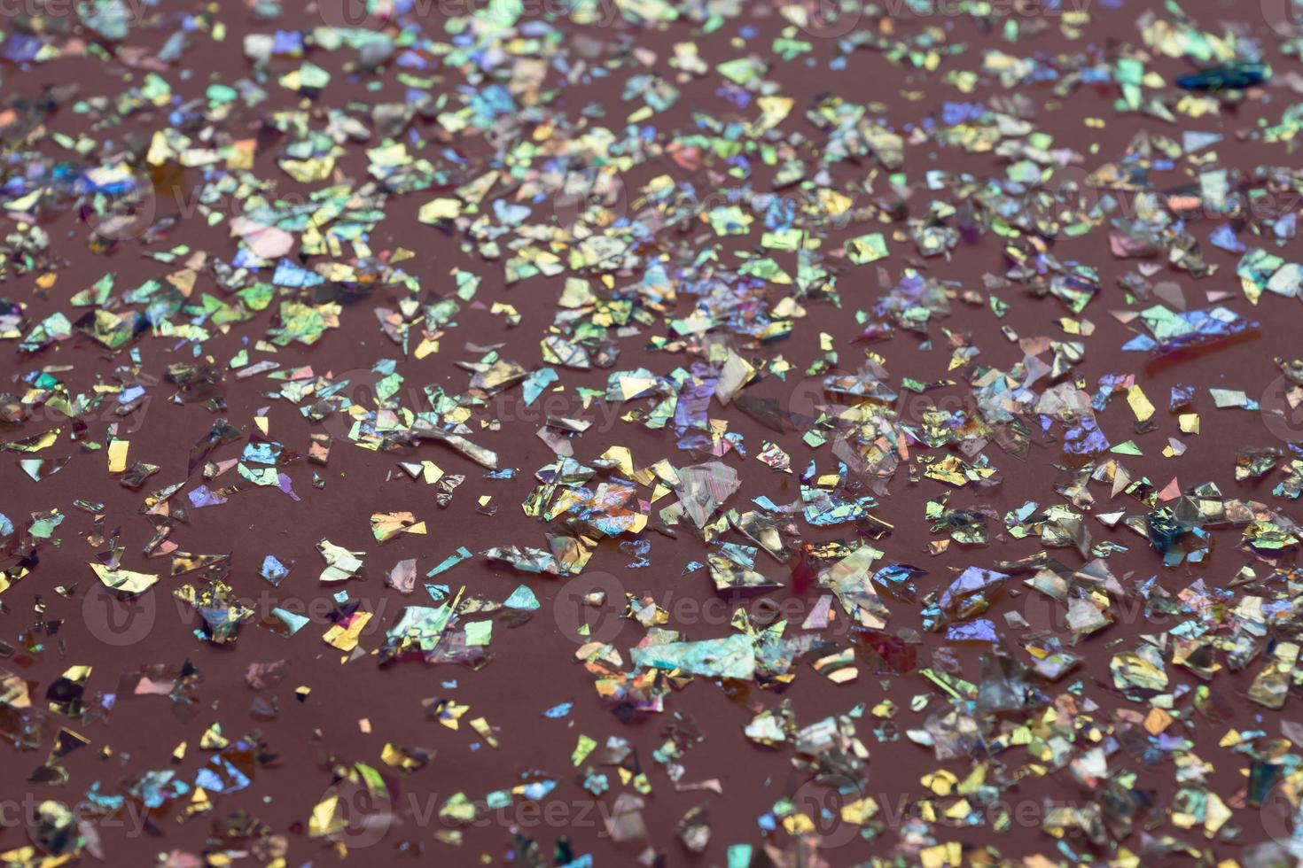 Neon pearl confetti and sparkles background. Top view, flat lay. Copyspace for text. Bright and festive holiday background. For Christmas, New year, Mother's day. photo