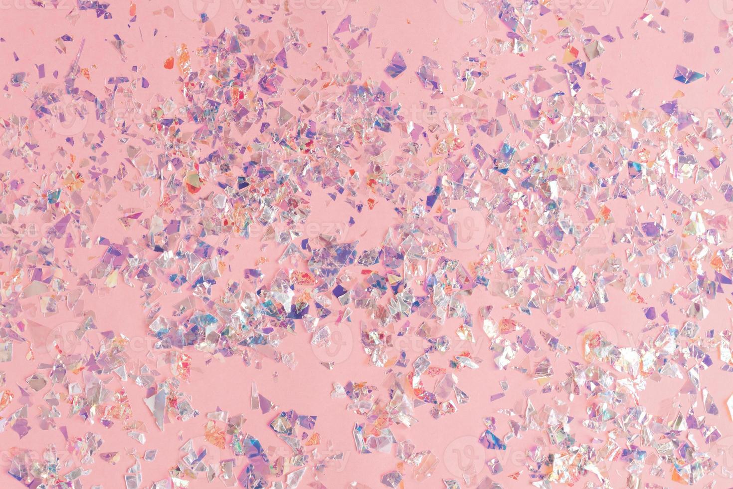 pearl confetti sparkles on pink holiday background. Festive backdrop of sparkles for birthday, carnival photo