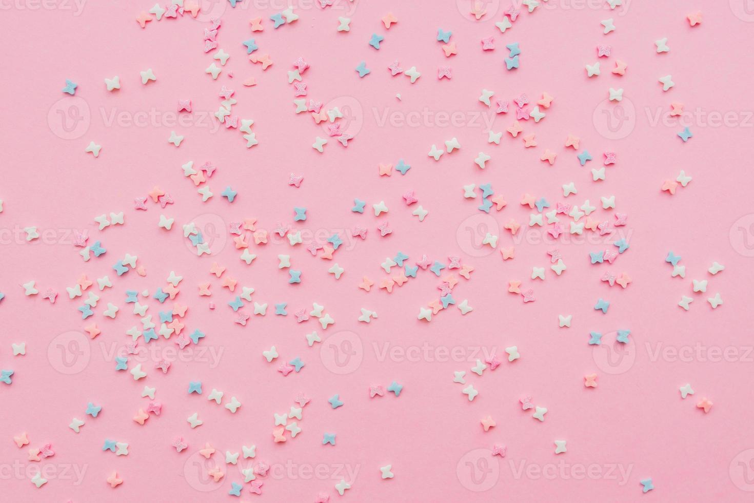 sprinkles background, sugar sprinkle butterflies, decoration for cake and bakery. Top view, flat lay. pastel colors photo