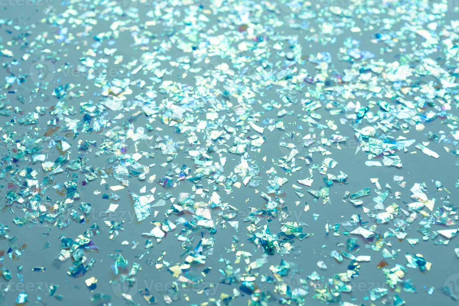 Neon pearl confetti and sparkles background. Top view, flat lay. Copyspace for text. Bright and festive holiday background. For Christmas, New year, Mother's day. photo