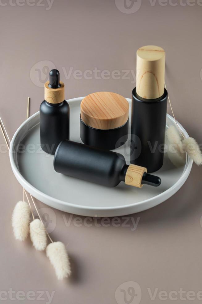 Set of natural organic cosmetics on ceramic tray. Face moisturizer