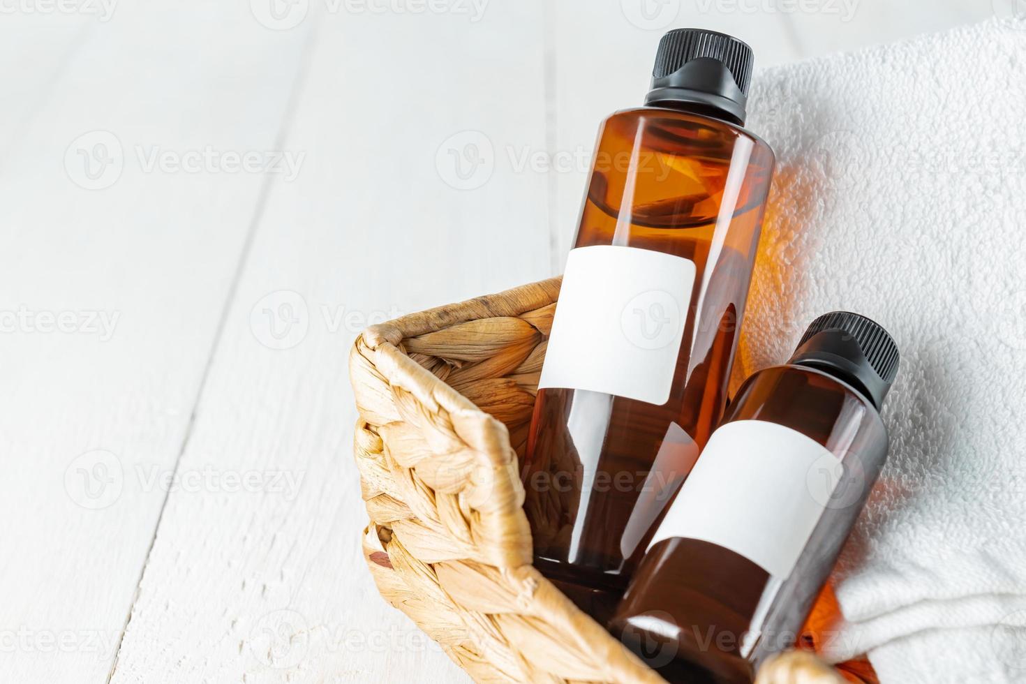 Spa body care concept. Anti cellulite cosmetics, white cotton towel on a bathroom table. photo