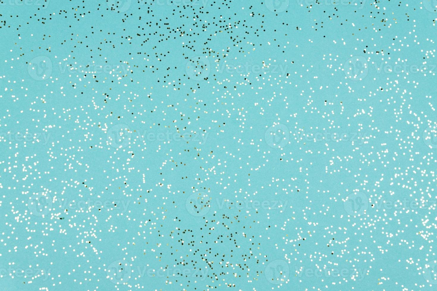 Blue Festive background texture with glittering silver confetti