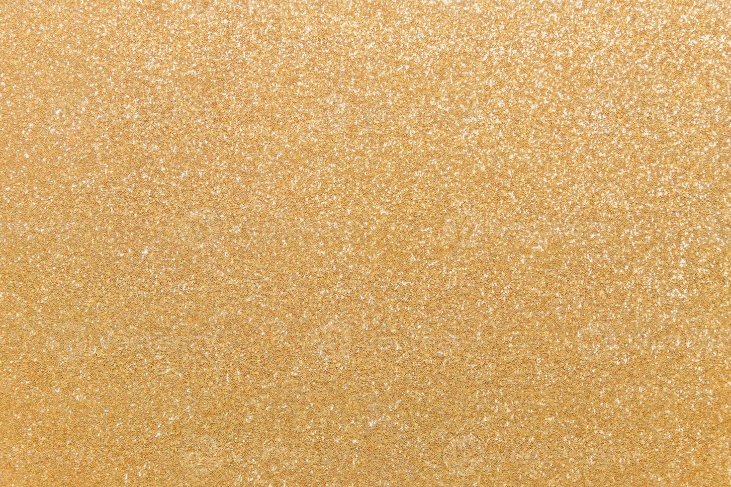Seamless pattern, golden glitter background. Sparkling flat lay with copy space for your projects. Trendy gold backdrop photo