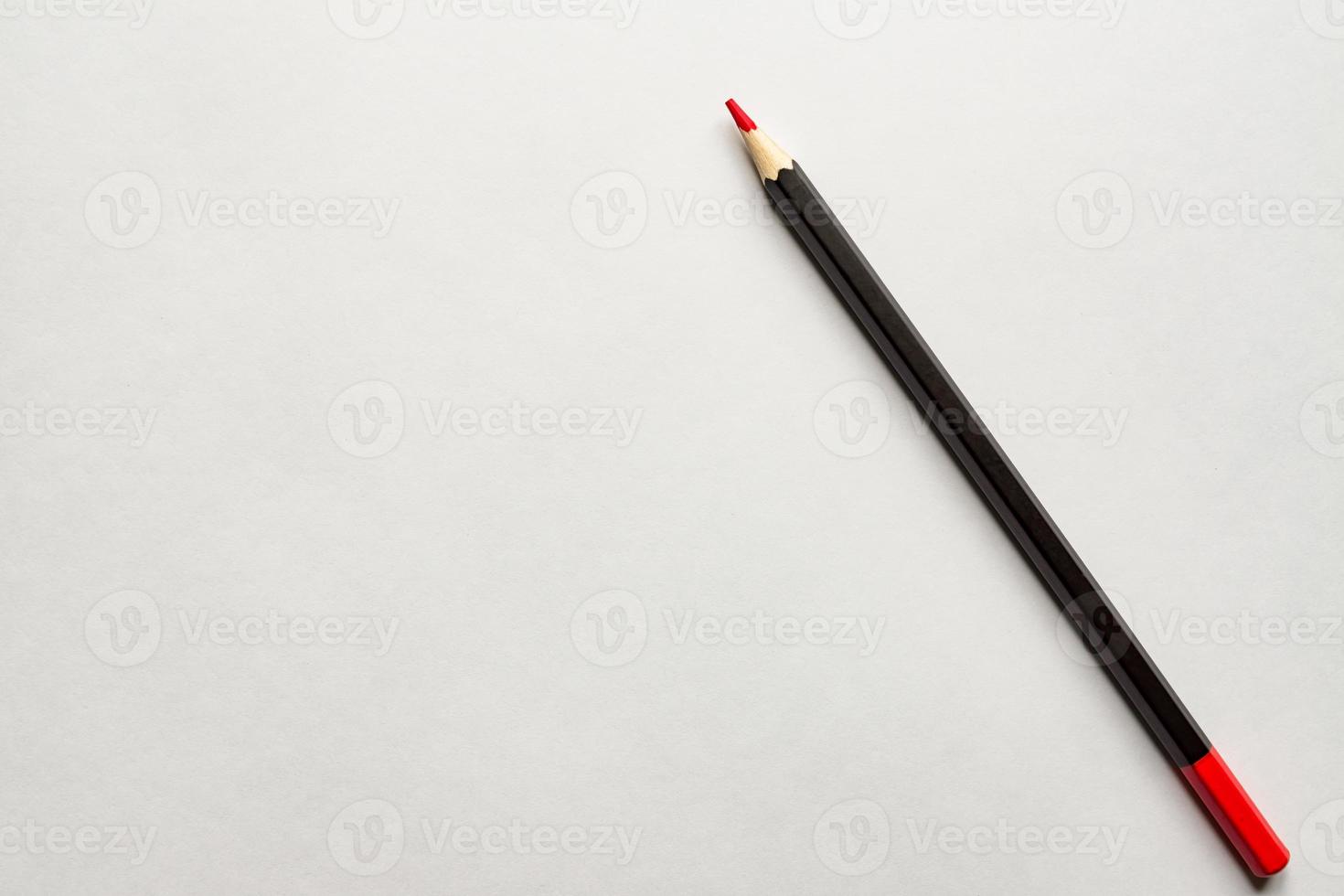 red pencil on blank white album paper. Top view. school and office supplies. Copy space. photo