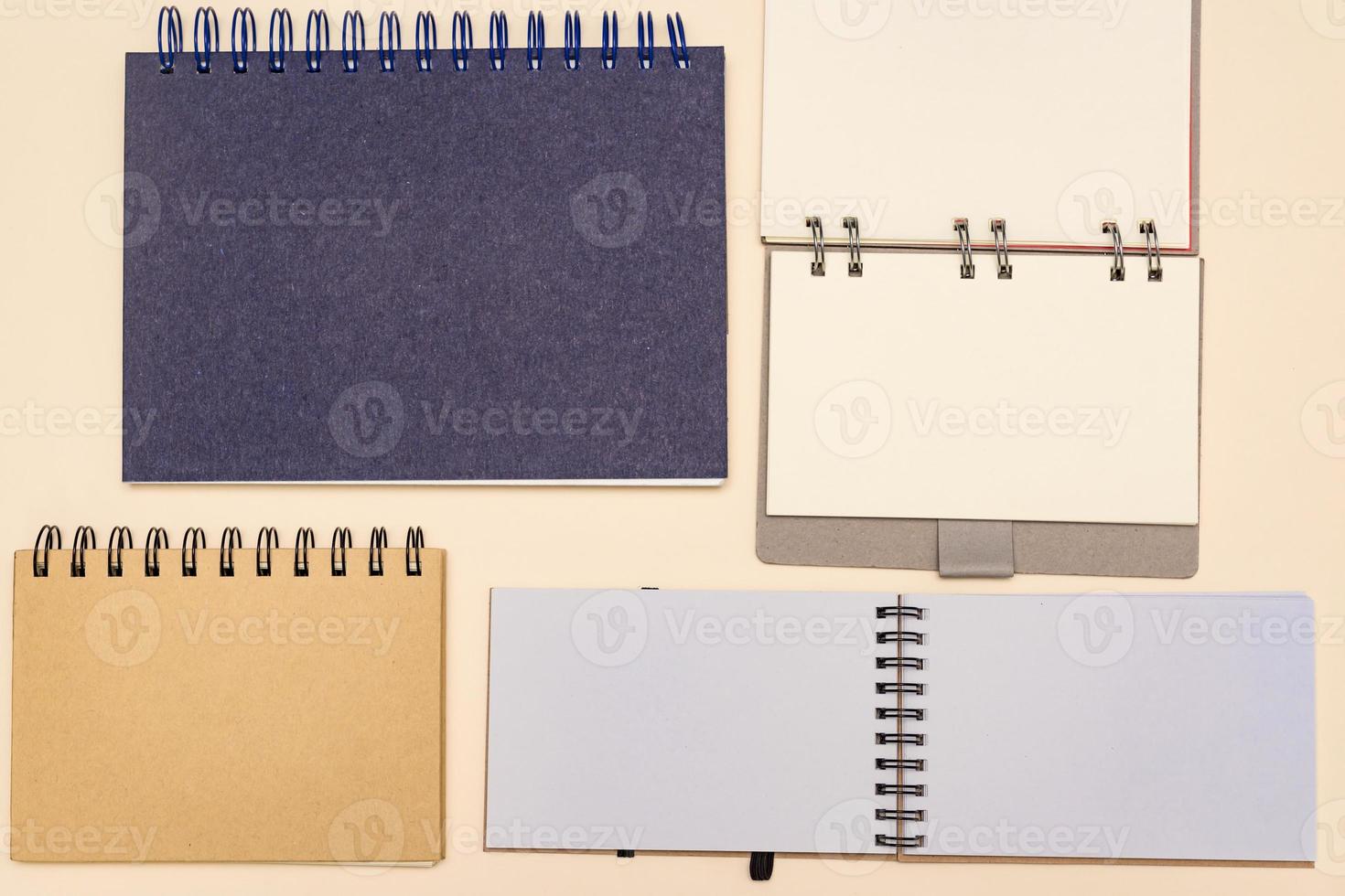 plenty of notebooks made from recycled paper. Stationery mock up template for your design. View from above. Flat lay photo