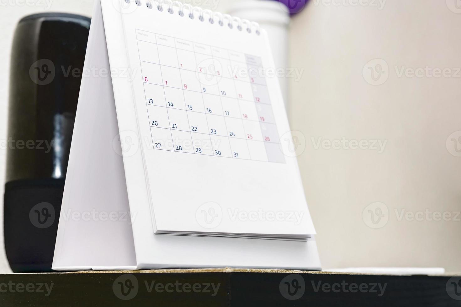 Close up of desc calendar on a table. Copy space. photo