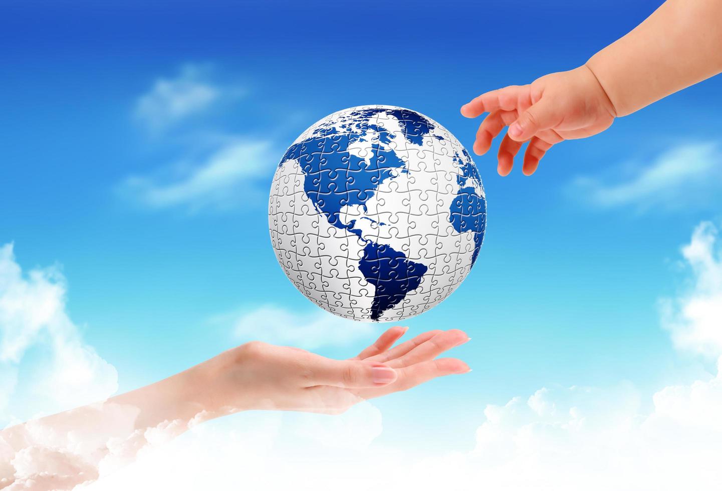 Child holding a globe in hands photo