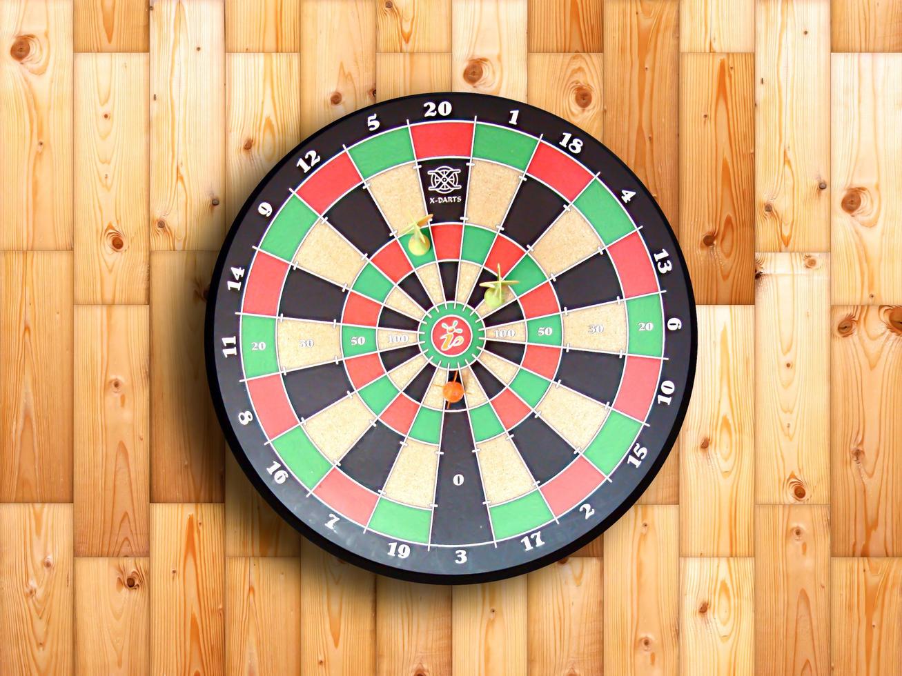 Dartboard on wood wall photo