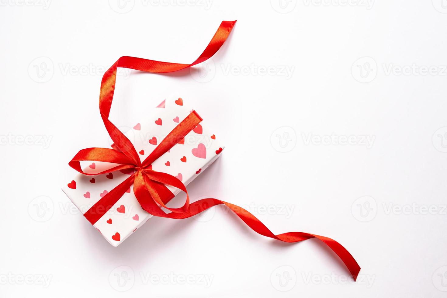 Festive St Valentne's day concept with gift box on white background. Top view, copy space photo