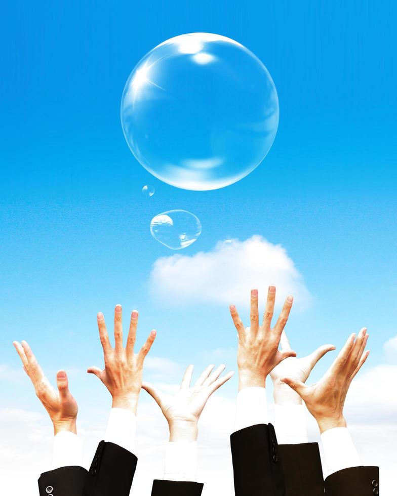 Hand hold Bubbles in the sky photo