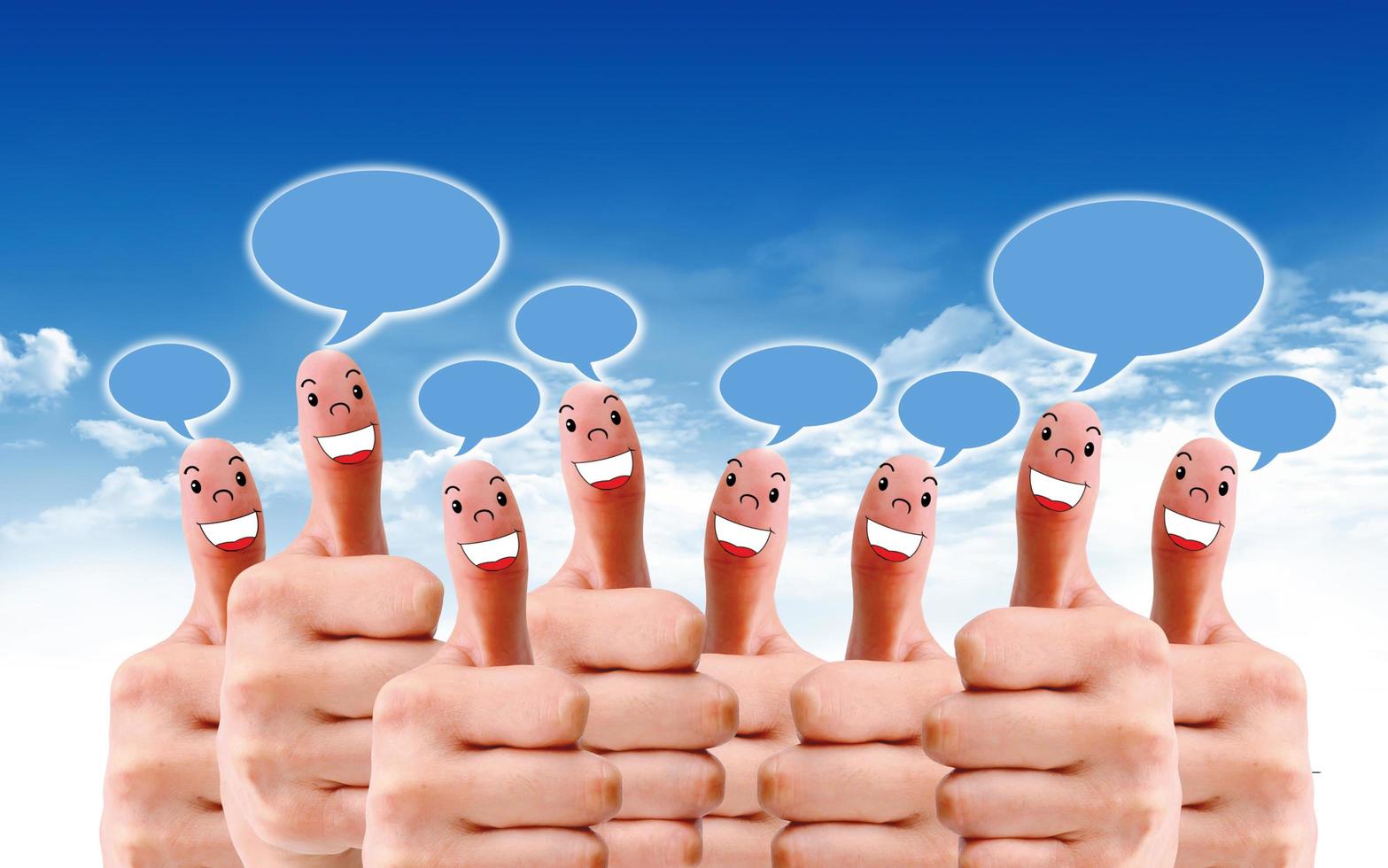 group of finger faces with social chat sign and speech bubbles photo