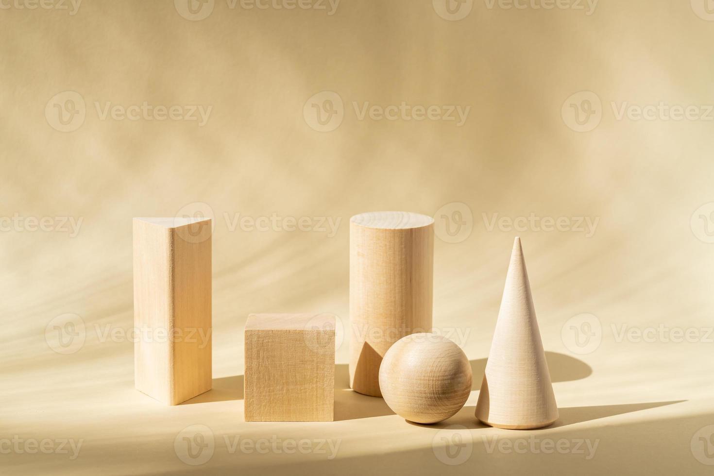 Wooden shapes on a beige background. Abstract geometric shapes. Empty podiums for your product. Minimalism style photo