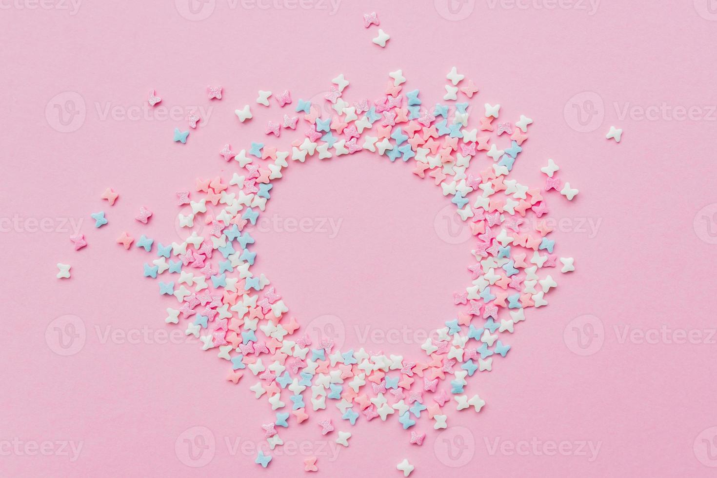Sprinkles grainy. Sweet confetti. Pink background for holiday designs, party, birthday with copy space. photo