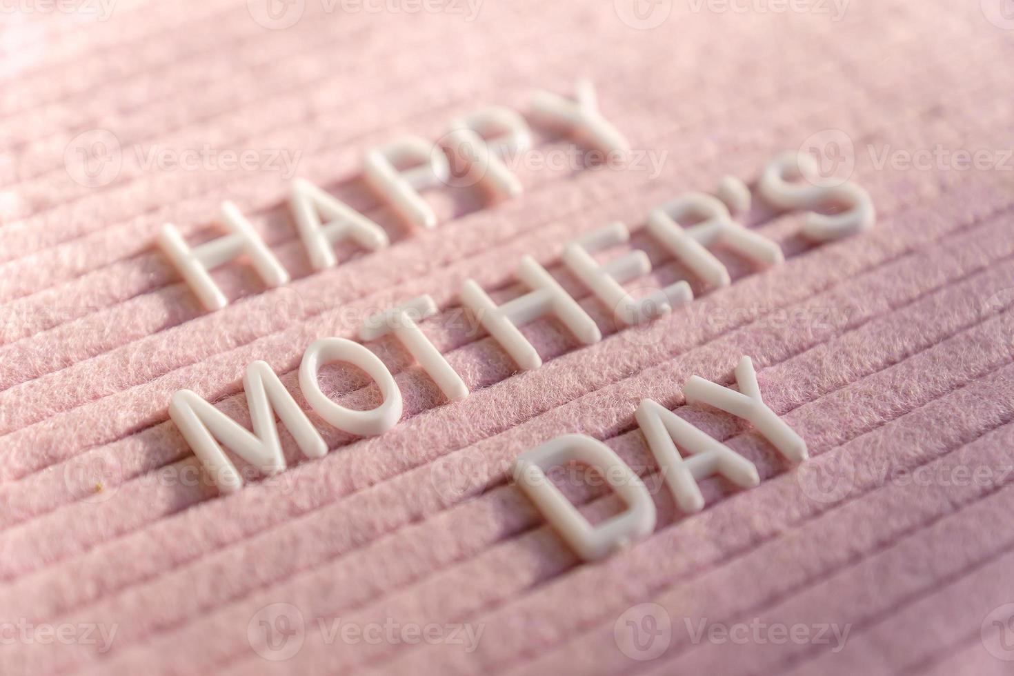 Words Happy Mother's Day on Pink Felt Letter Board. Festive composition fith selective focus. photo