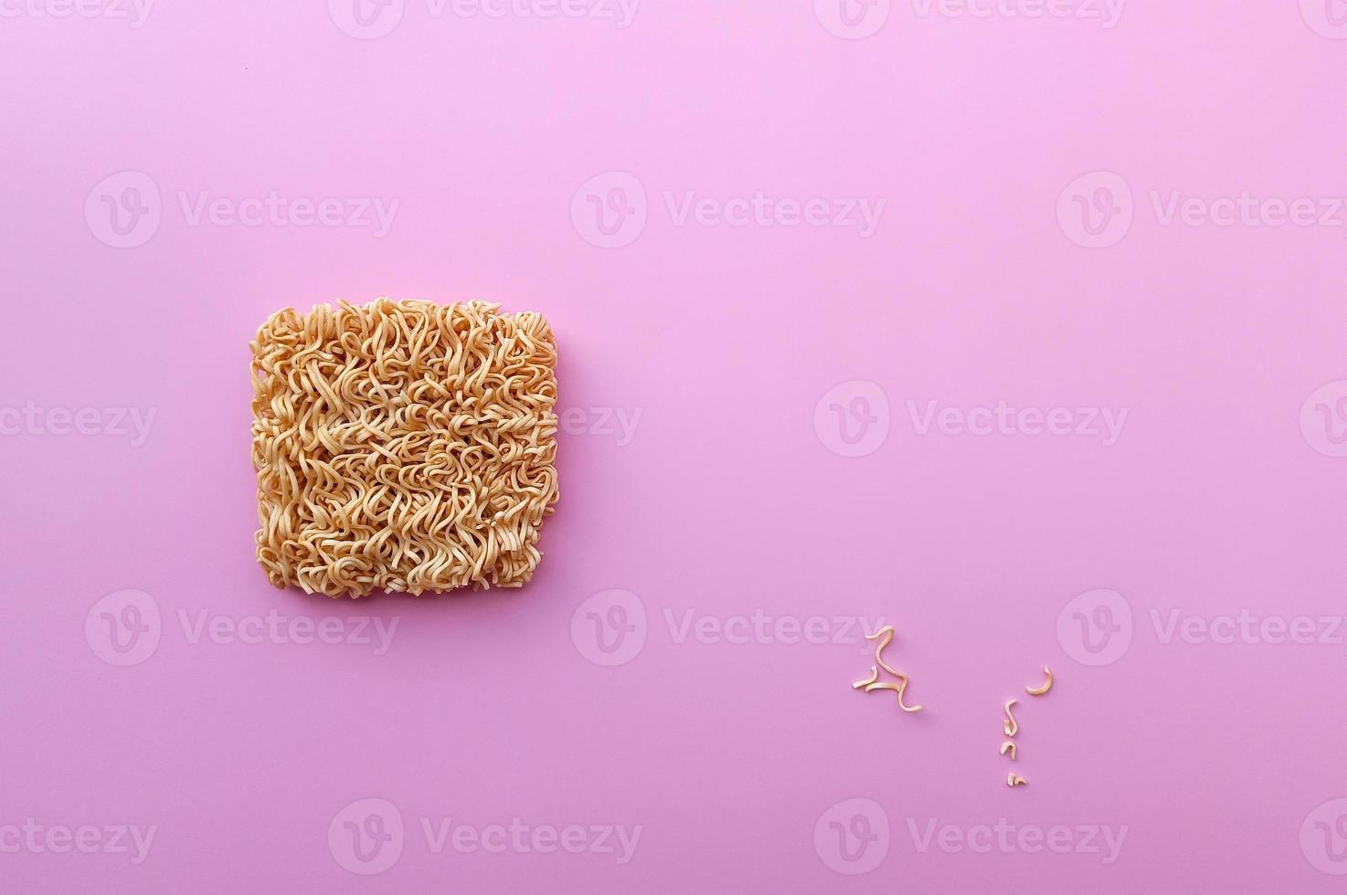 instant noodle on pink background with copy space photo