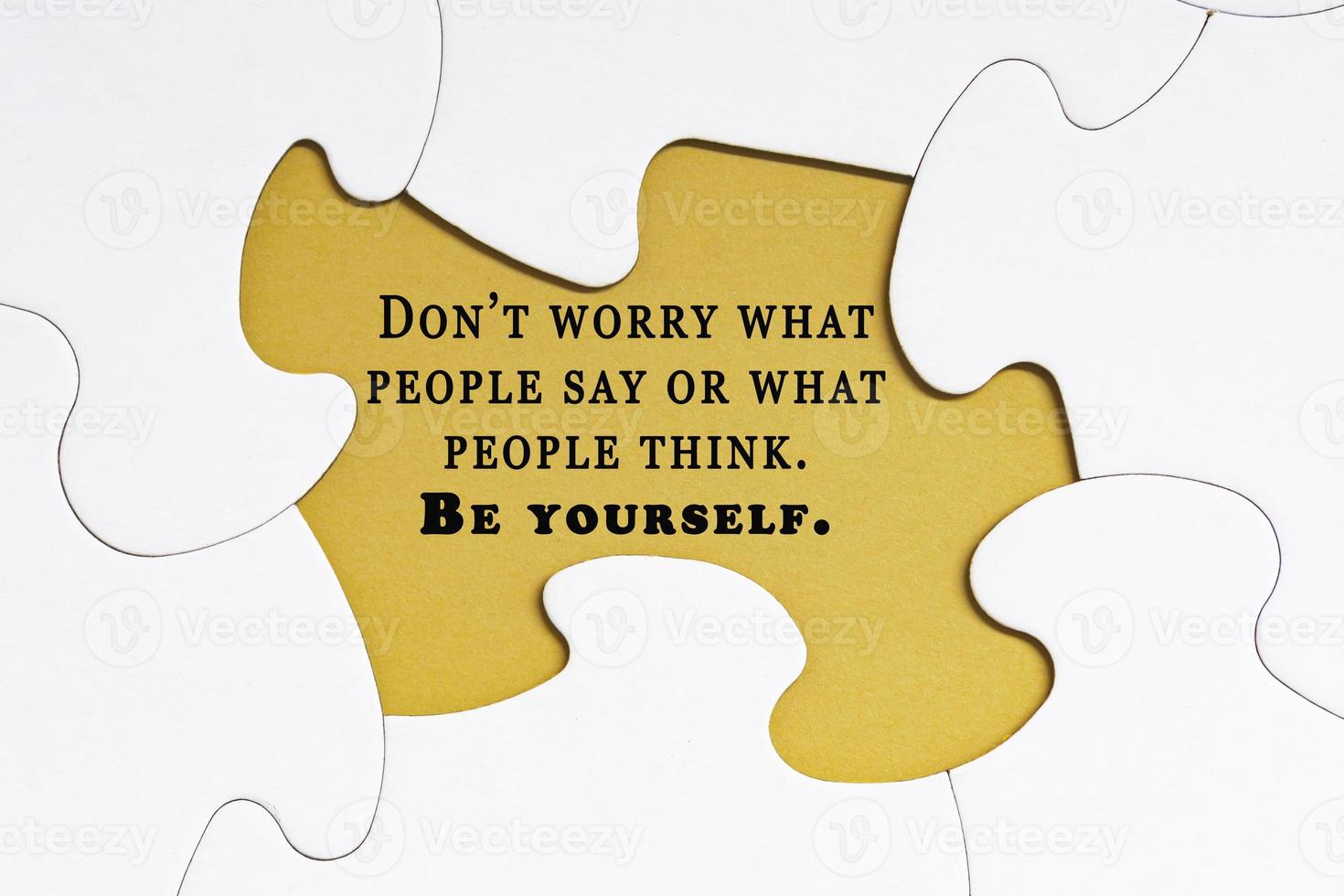 Motivational quote on jigsaw puzzle with some missing pieces. photo