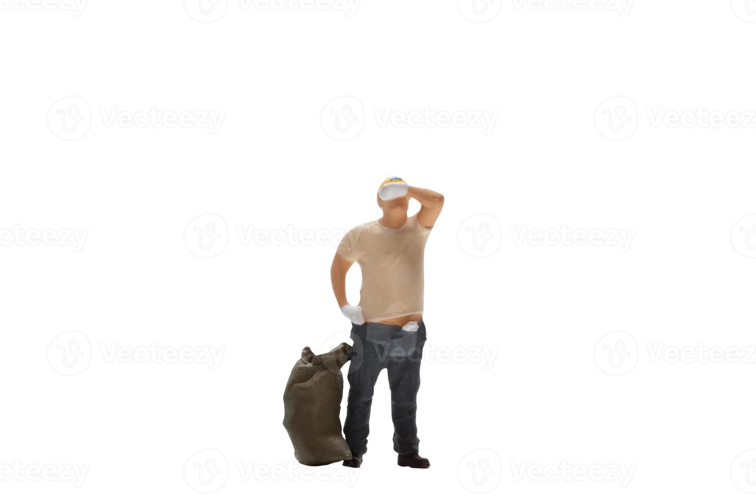 Miniature worker isolated on white background with clipping path photo