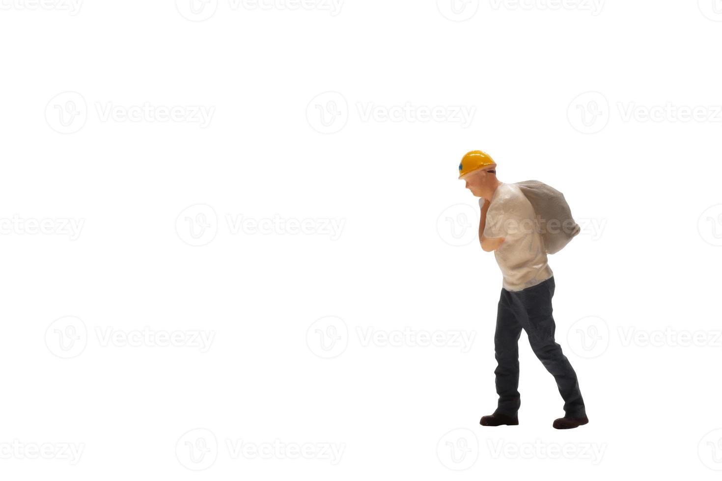 Miniature worker isolated on white background with clipping path photo