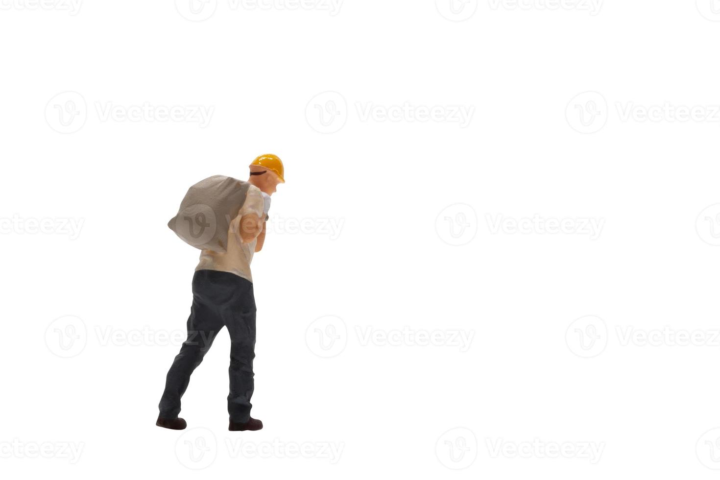 Miniature worker isolated on white background with clipping path photo