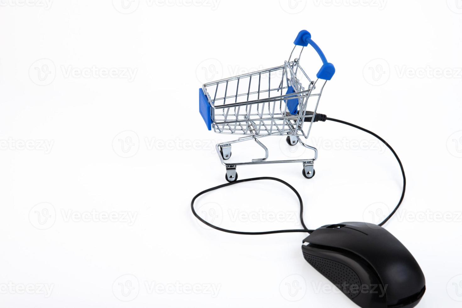 PC mouse, shopping cart, supermarket trolley, e-commerce, digital commerce, retail on a white background. Copy space. photo