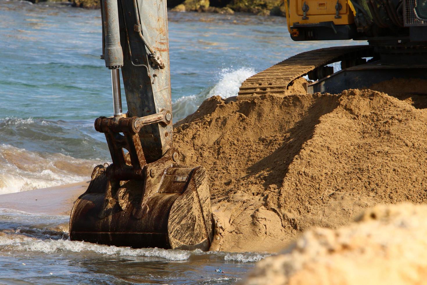 Nahariya Israel March 4, 2020. A large excavator is working at a construction site. photo