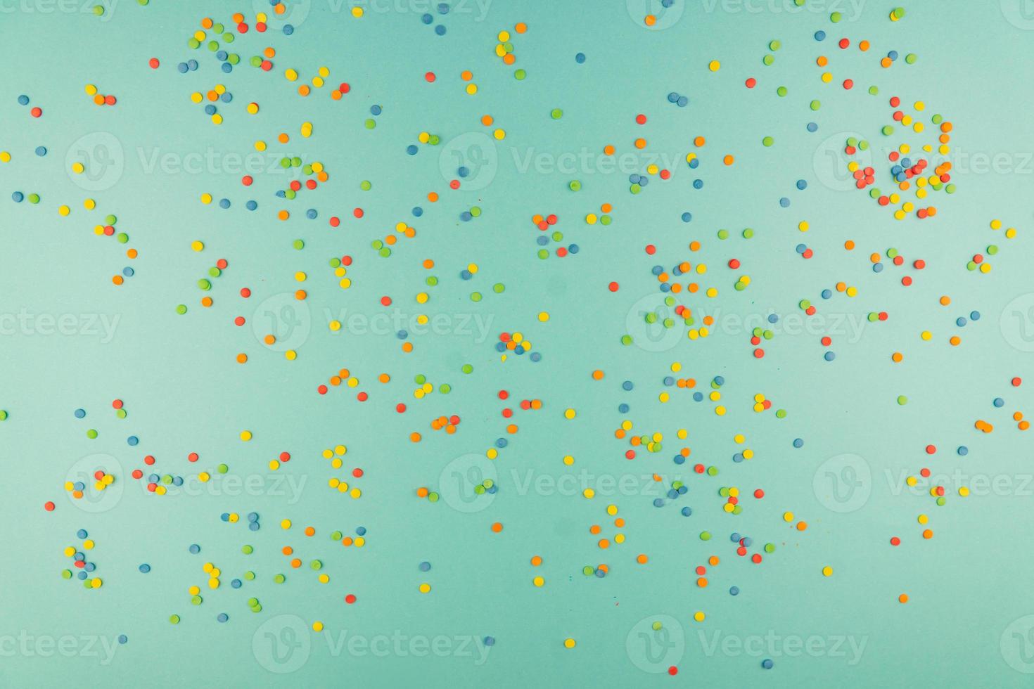 sprinkles background, sugar sprinkle confetti, decoration for cake and bakery. Top view, flat lay. pastel colors photo