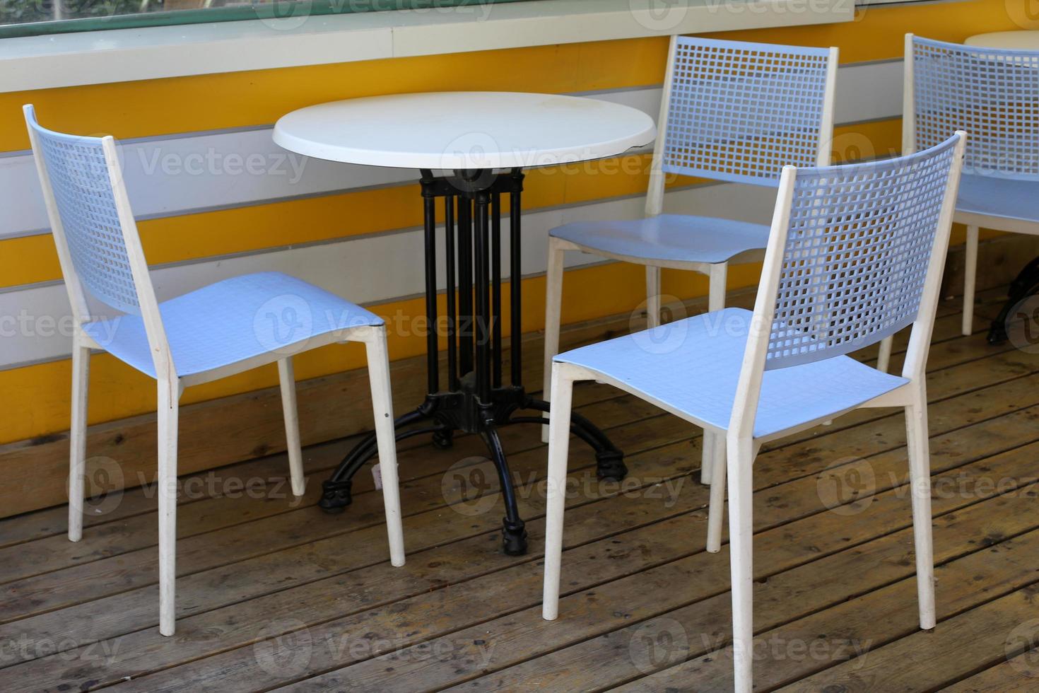 A chair in a city park on the seashore. photo