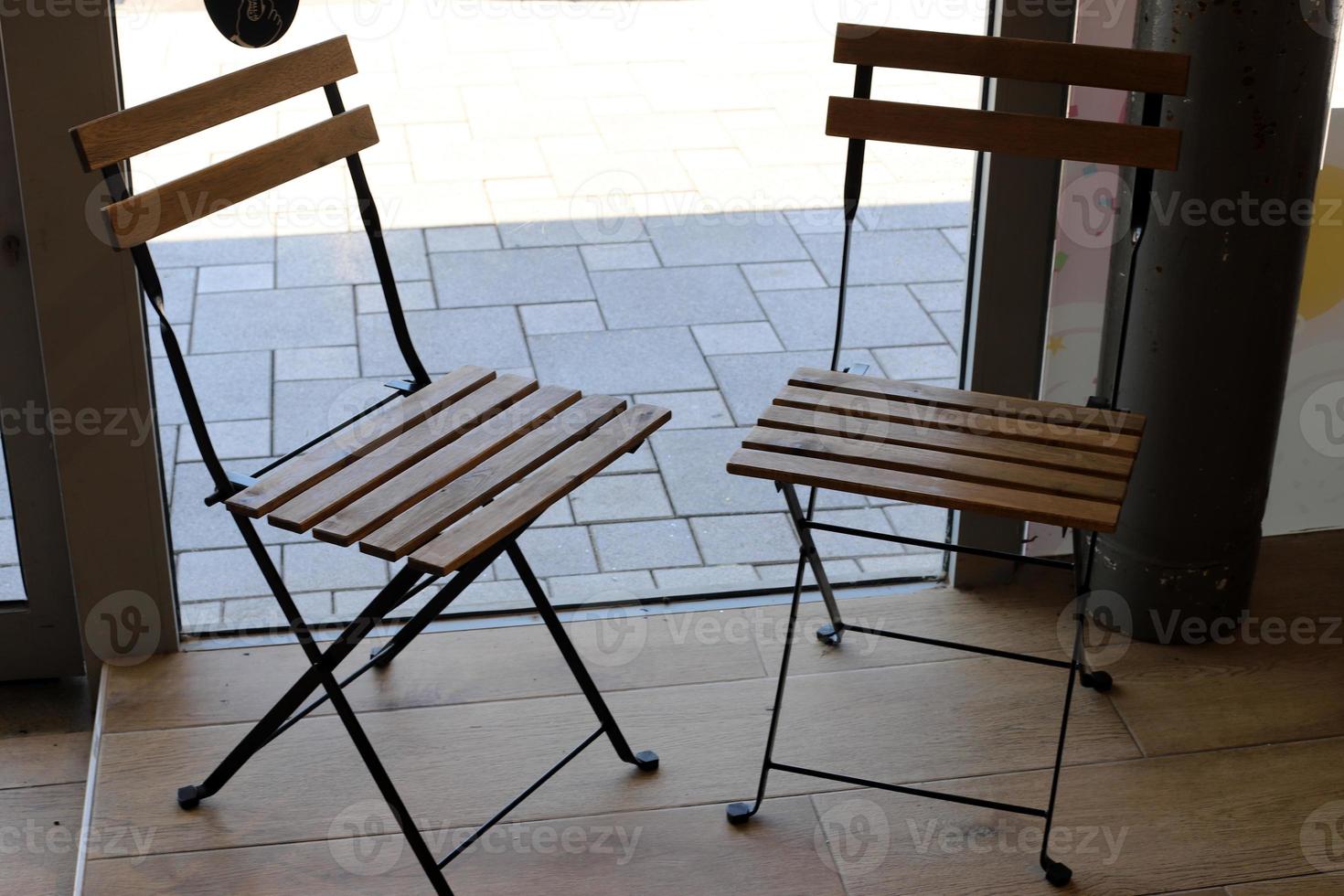 A chair in a city park on the seashore. photo