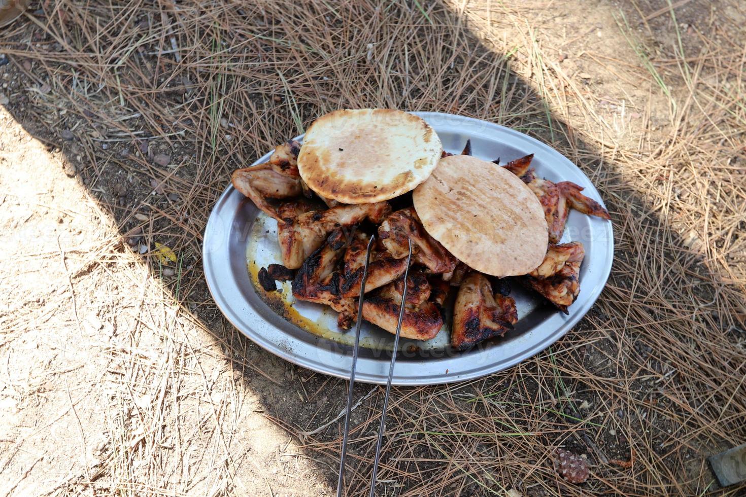 Vegetables and meat are fried on the grill. photo