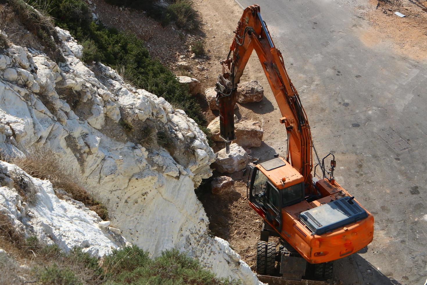 Nahariya Israel March 4, 2020. A large excavator is working at a construction site. photo