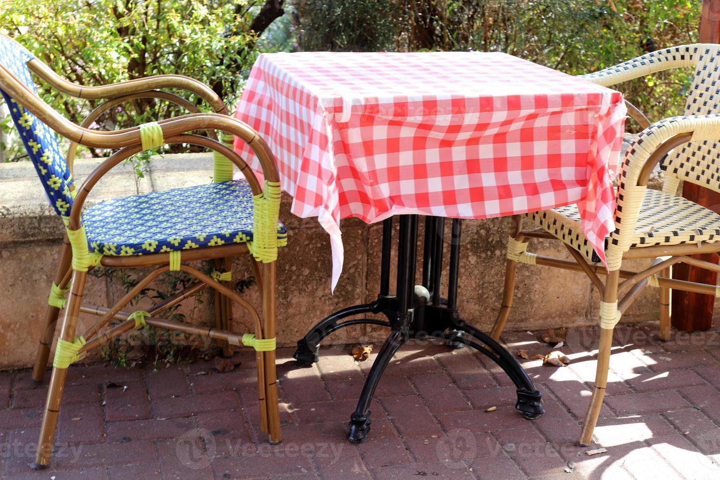 A chair in a city park on the seashore. photo