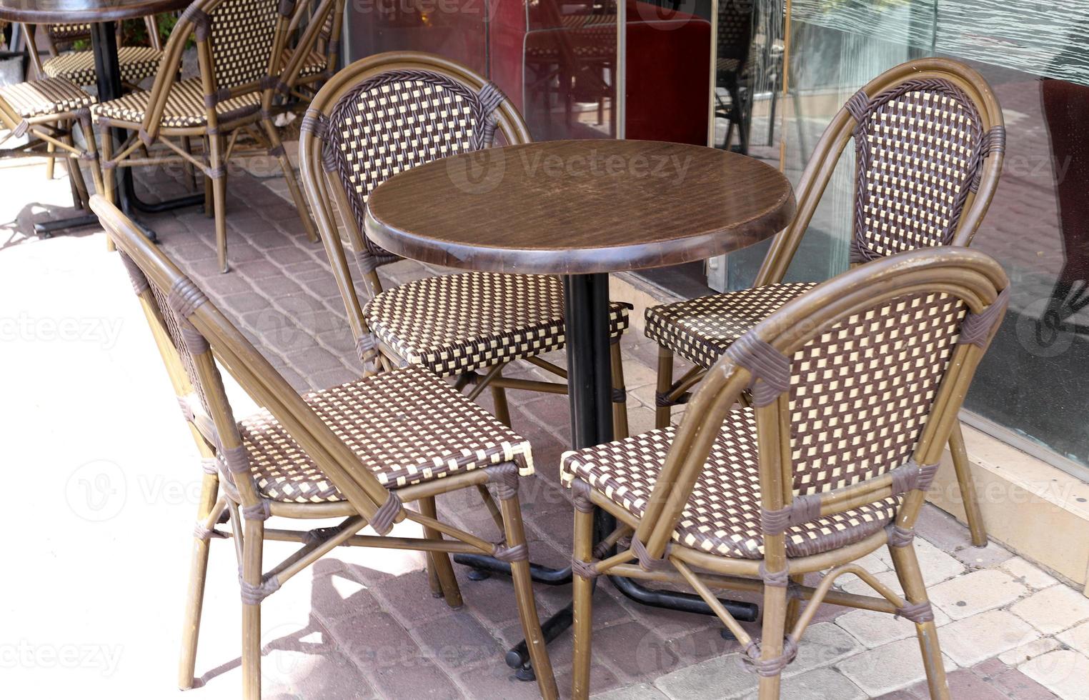 A chair in a city park on the seashore. photo