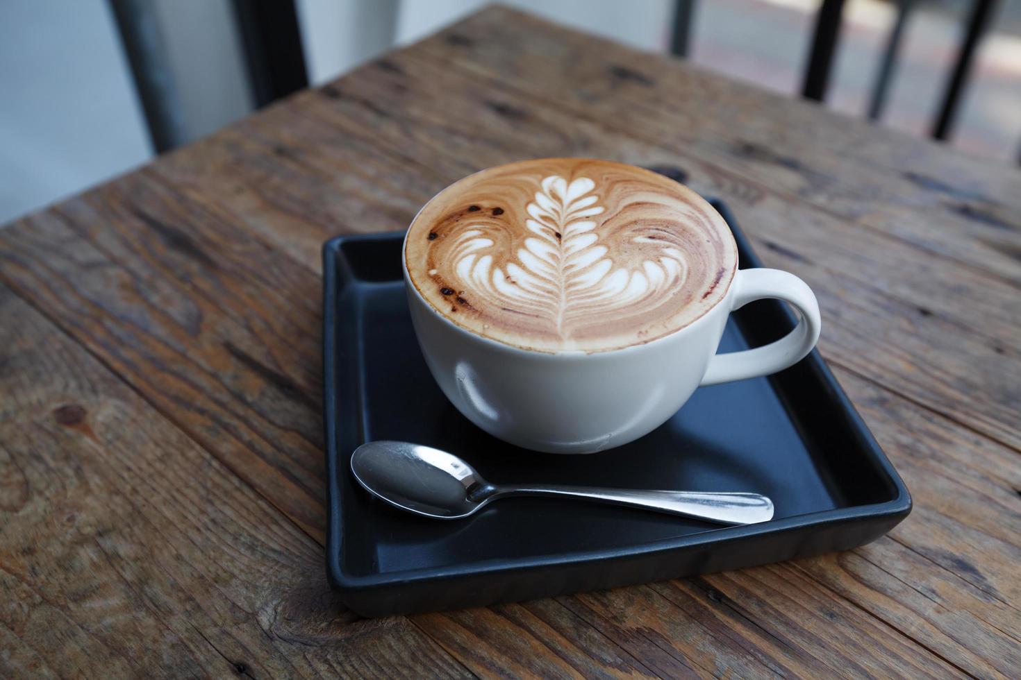 A cup of coffee mocha on wooden photo