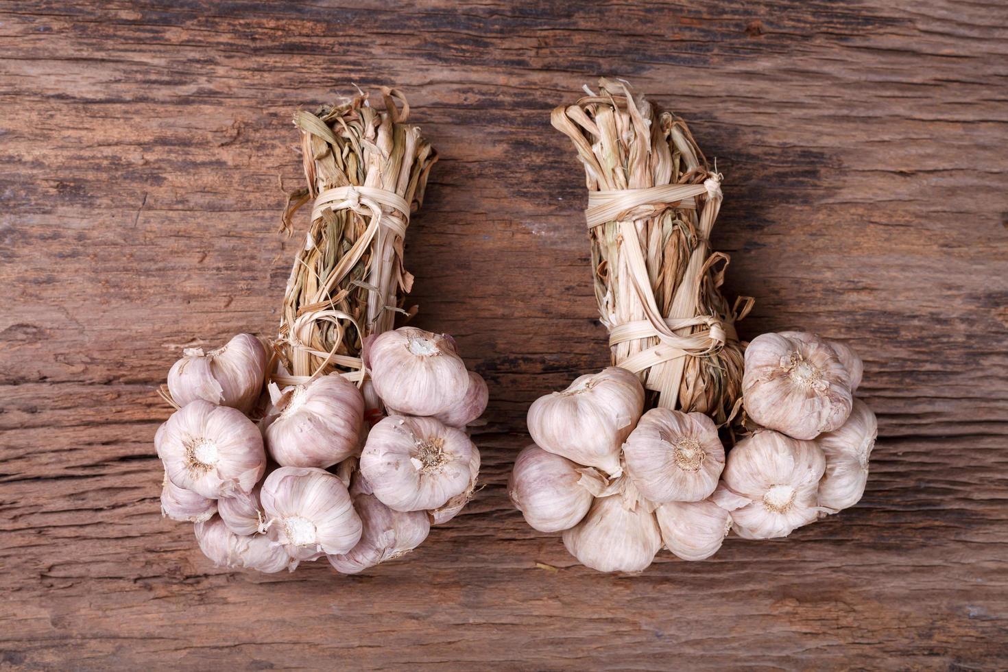 garlic on wooden background photo