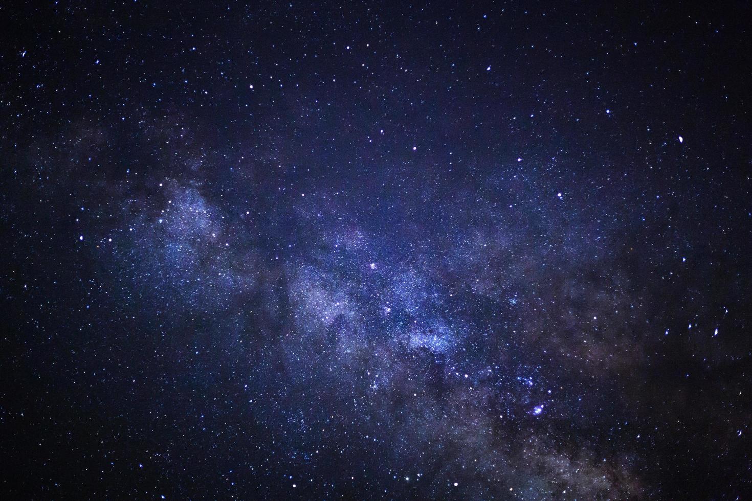 Starry night sky, Milky way galaxy with stars and space dust in the universe, Long exposure photograph, with grain. photo