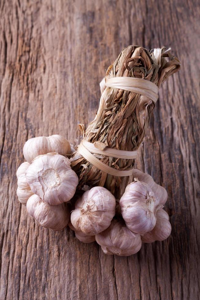 garlic on wooden background photo