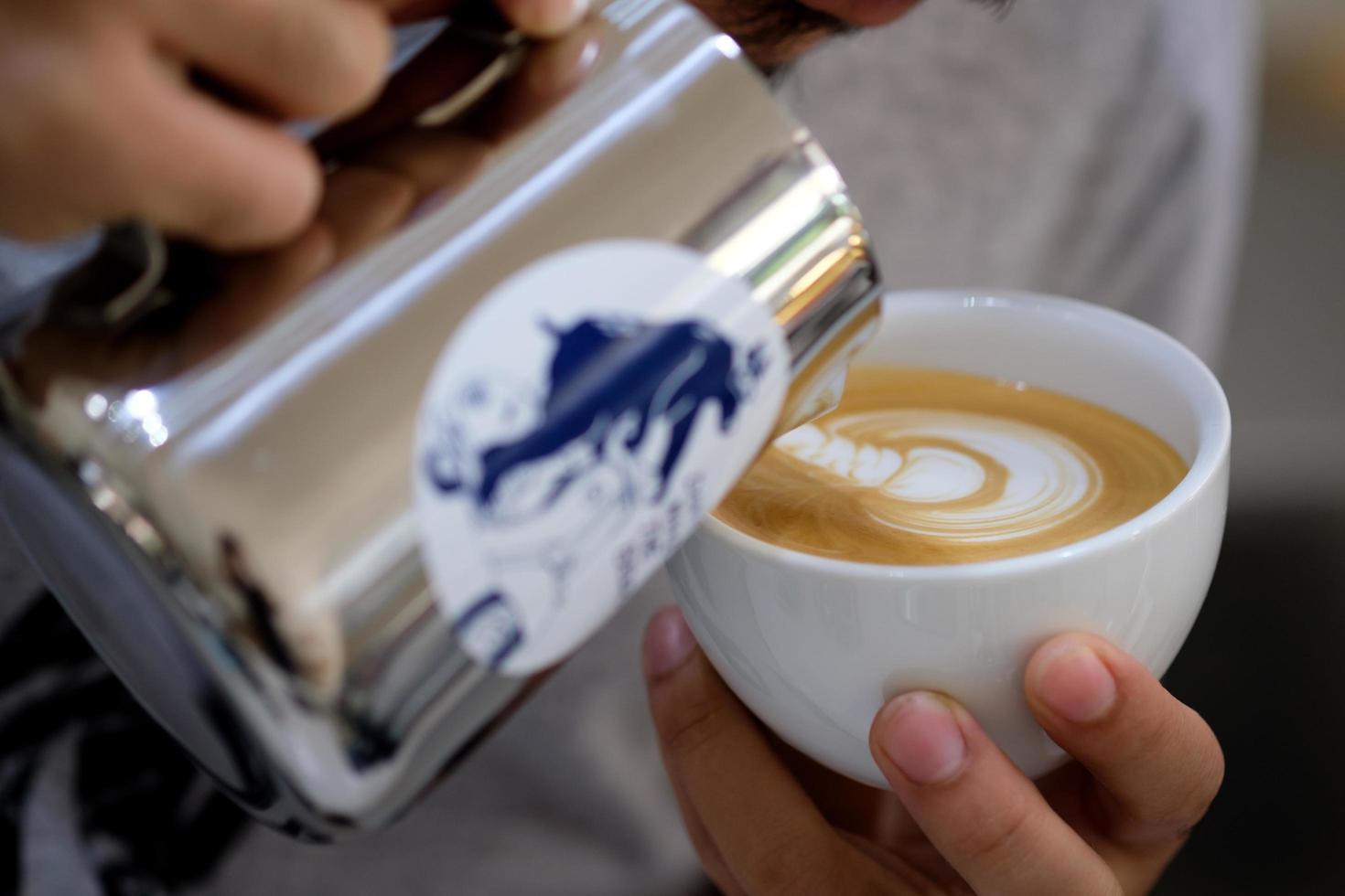 Making of latte art by barista photo