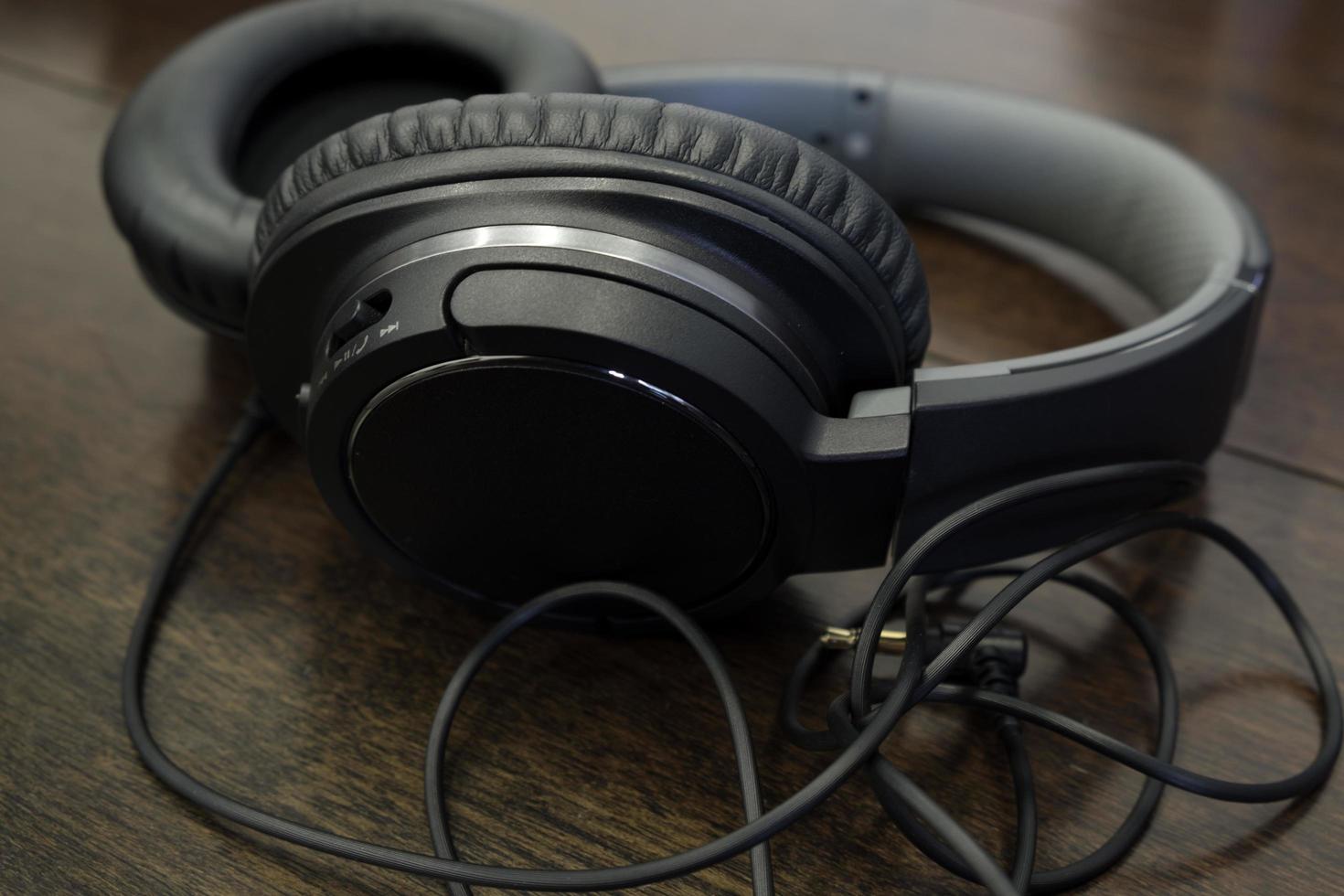 headphones on wood table photo