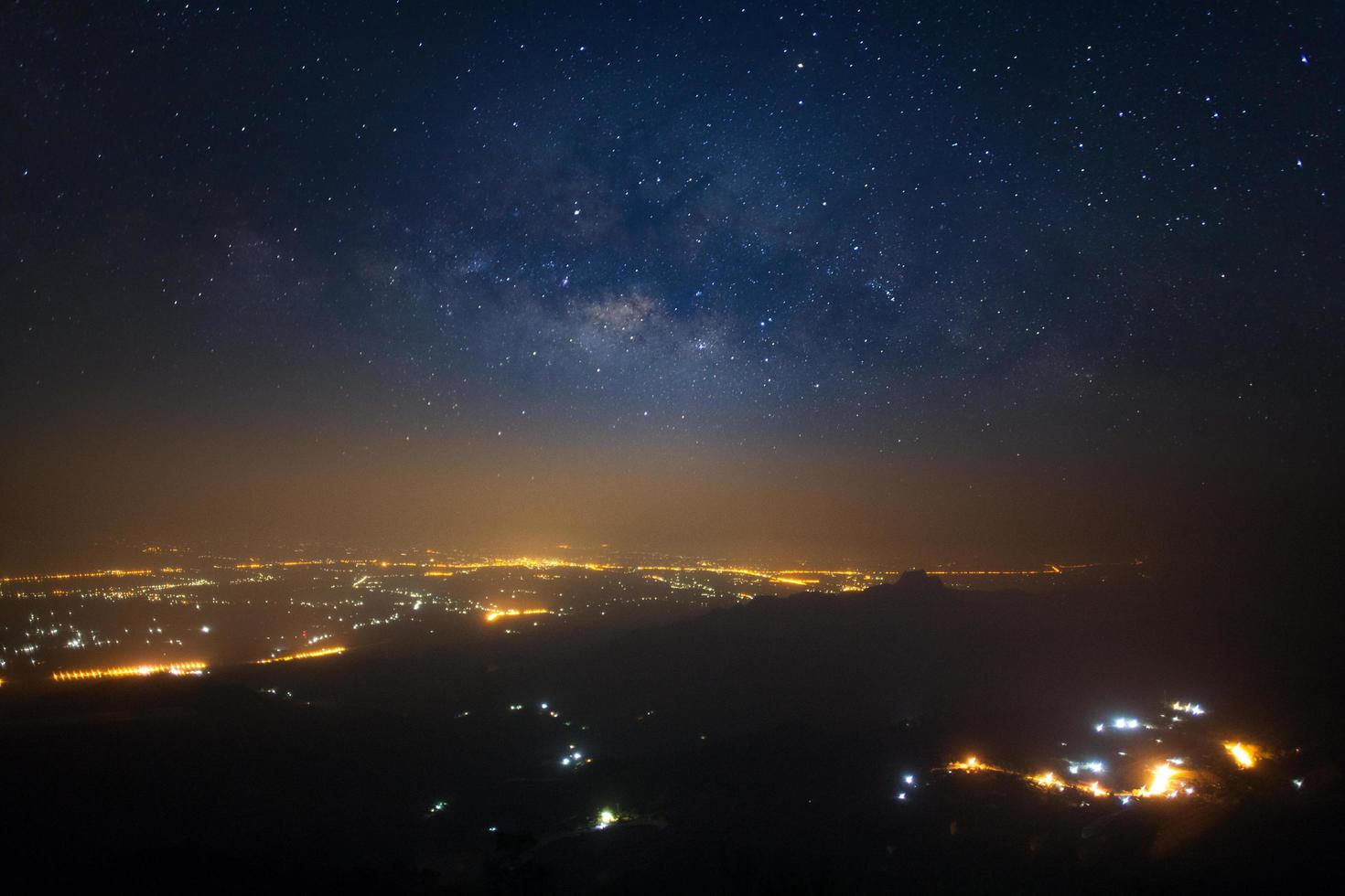 Milky way galaxy at Phutabberk Phetchabun in Thailand.Long exposure photograph.With grain photo