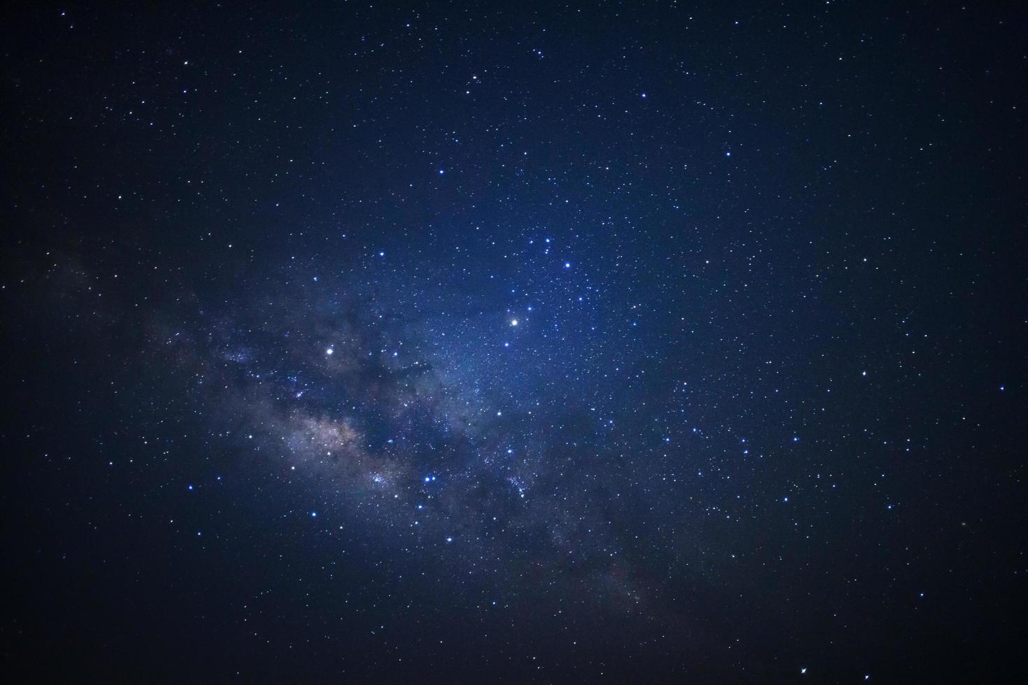 Starry night milky way astronomy. Long exposure photograph.with grain photo