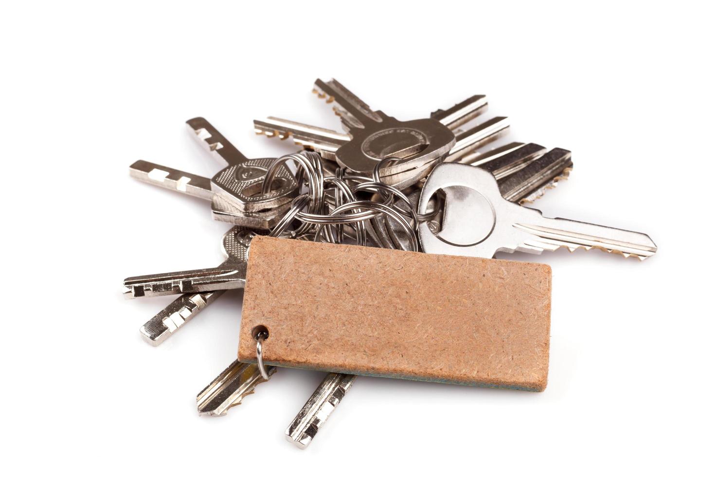 Set of old house keys isolated on the white photo