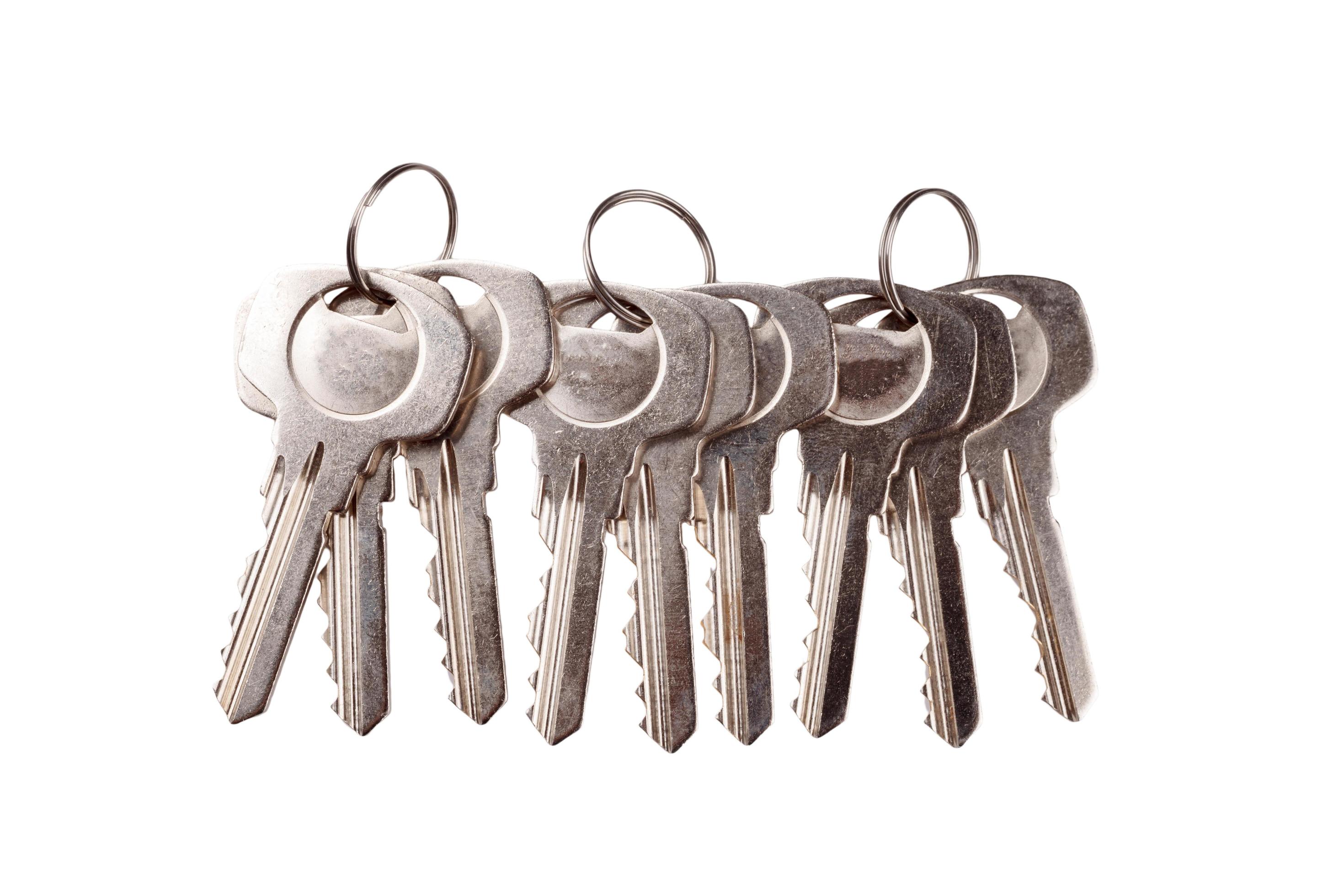 Set of old house keys isolated on the white 11041746 Stock Photo at