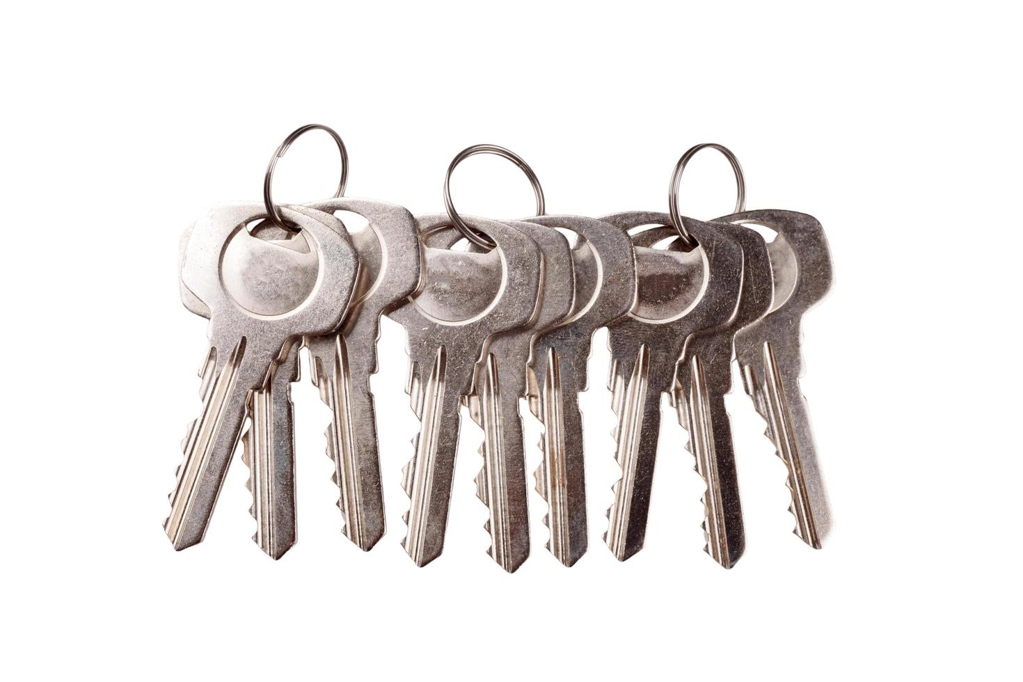 Set of old house keys isolated on the white photo