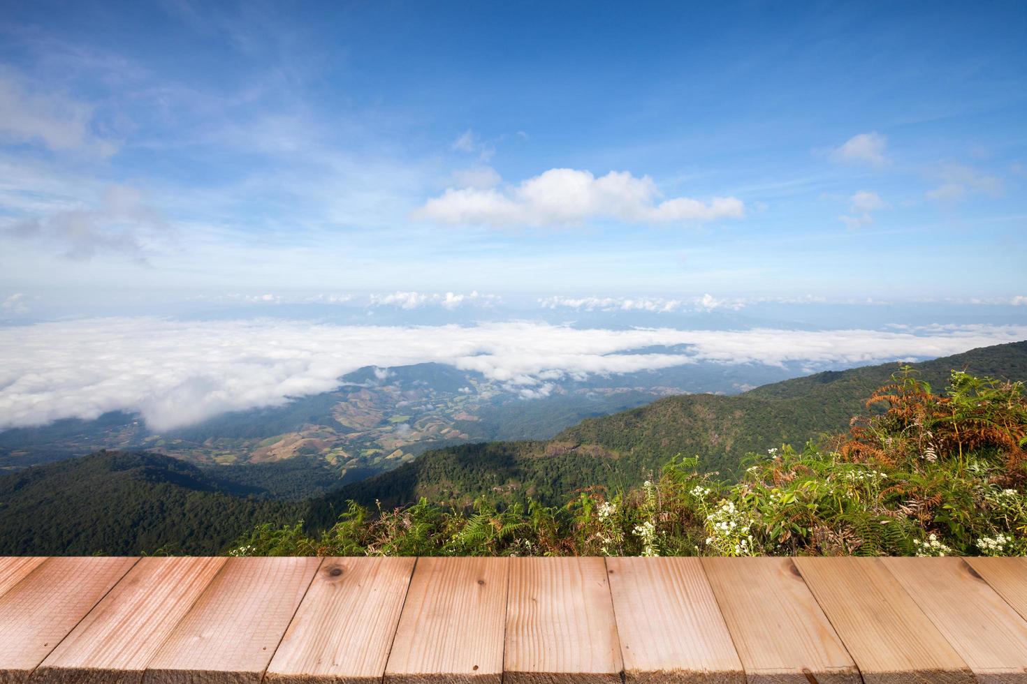 Wood table top on view mountain and blue sky photo