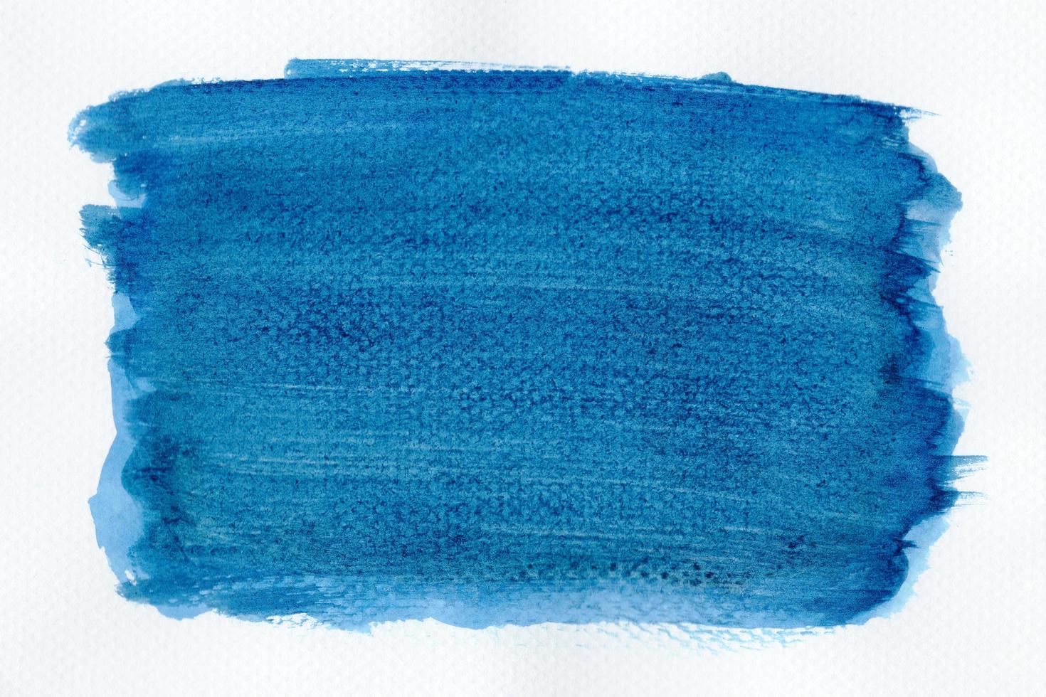 Abstract blue watercolor on white background.The color splashing on the paper.It is a hand drawn. photo