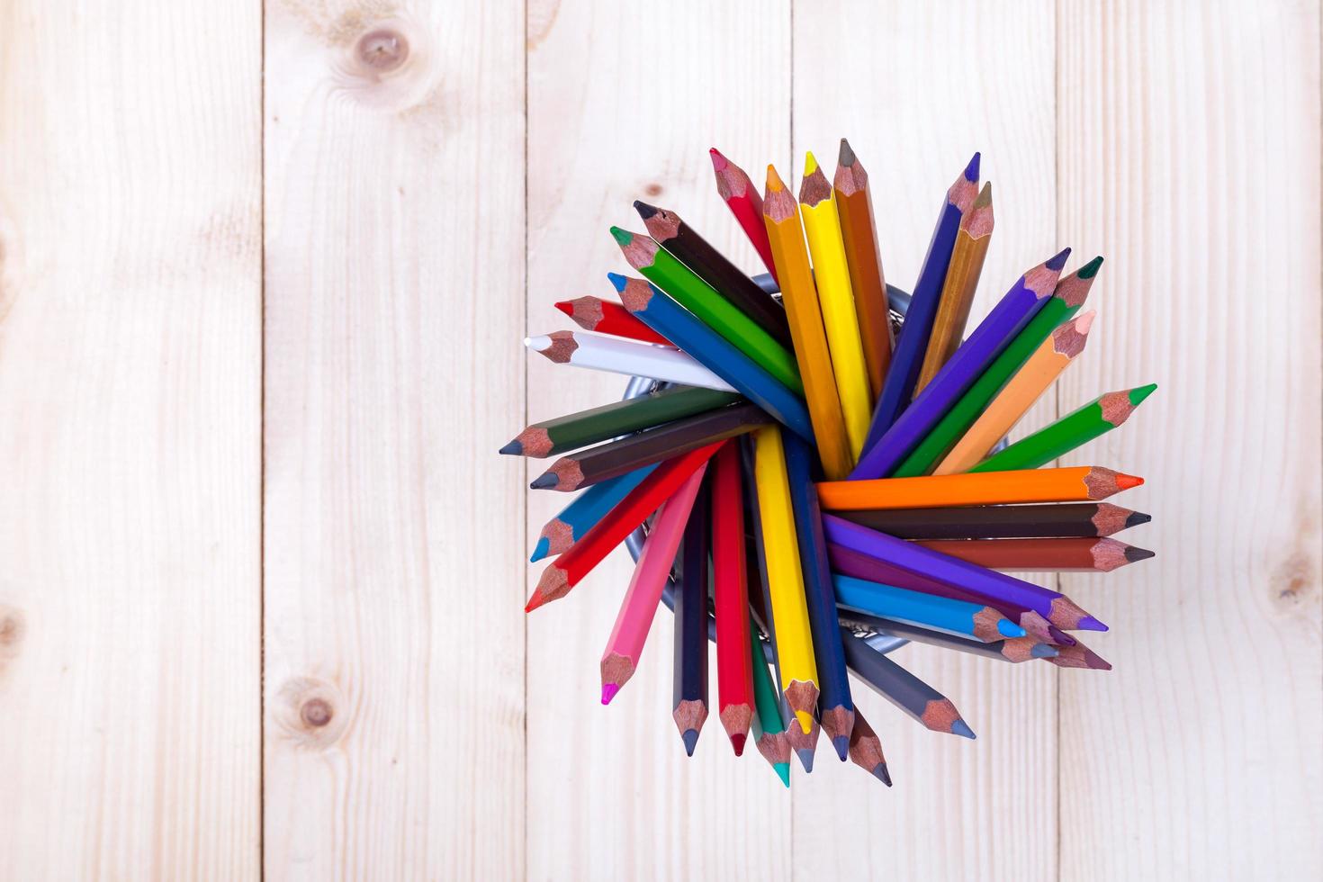 Color pencils on wood table photo