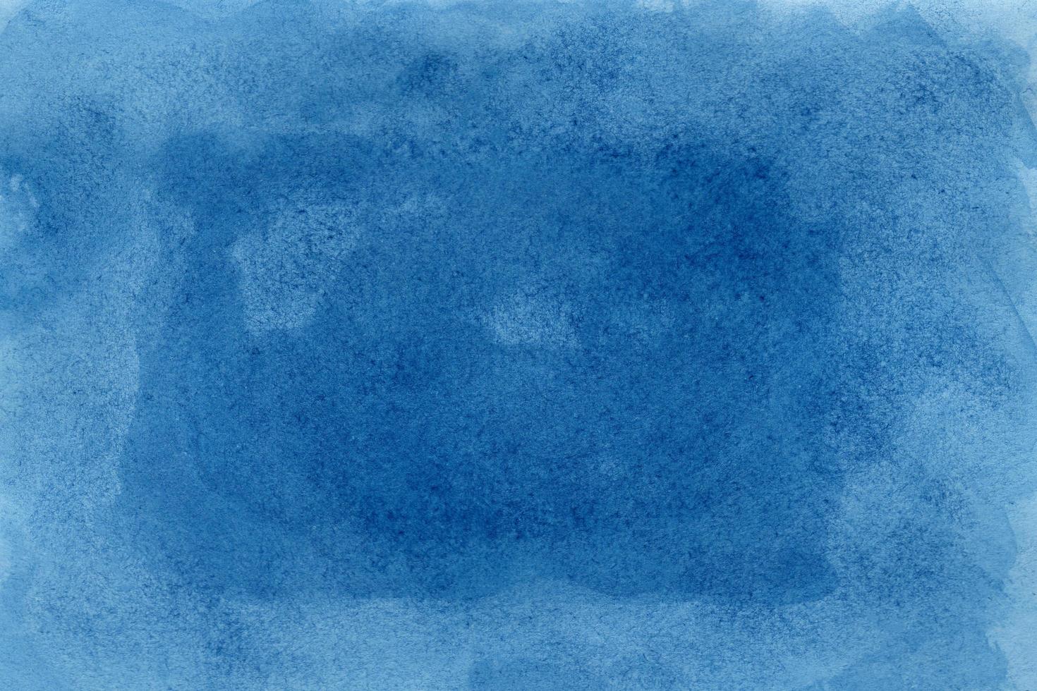 Abstract blue watercolor on white background.The color splashing on the paper.It is a hand drawn. photo