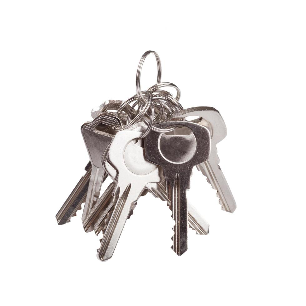 Set of old house keys isolated on the white photo