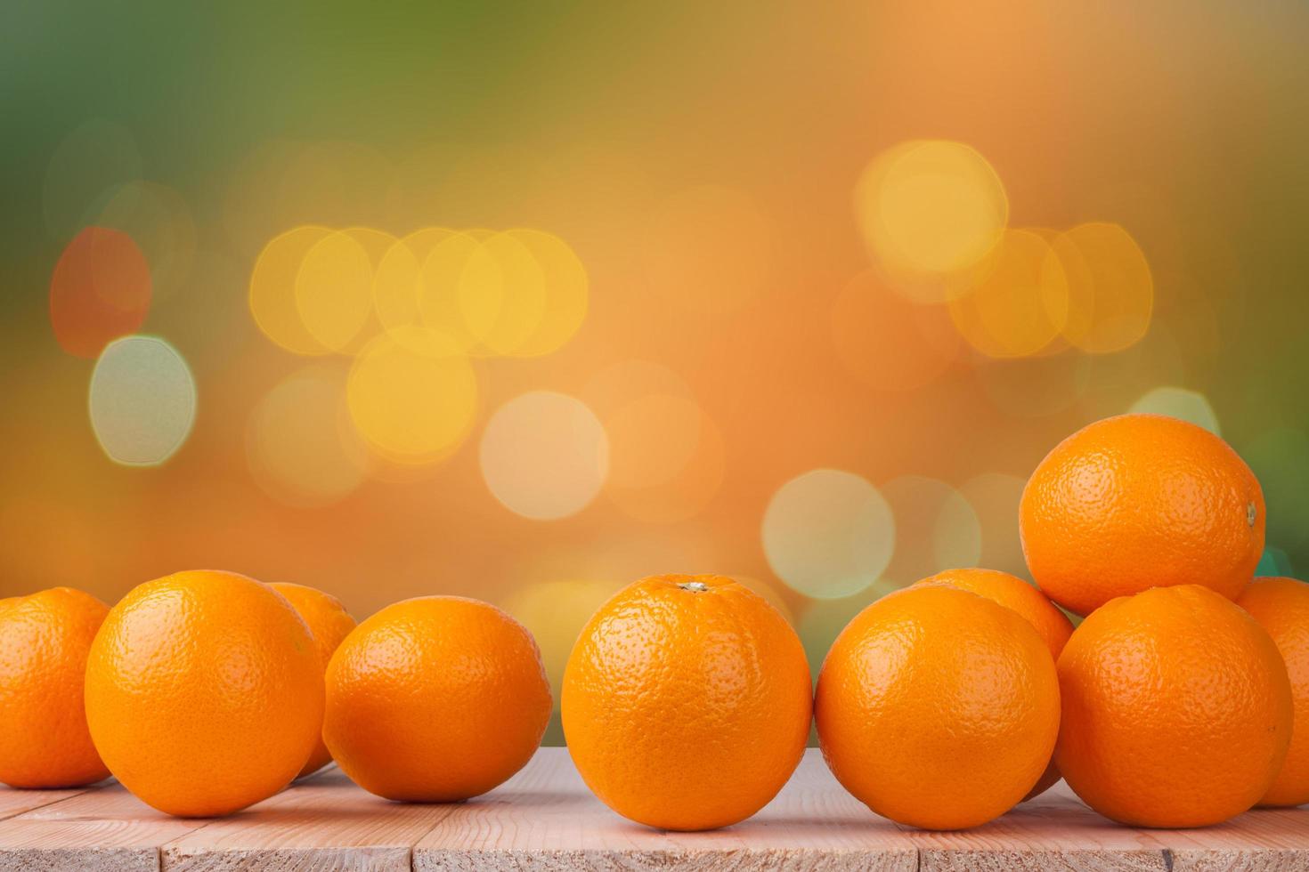 Fresh orange on wood with blur bokeh background photo